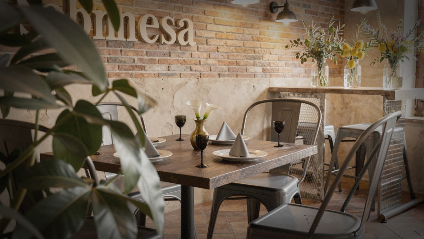 Mesa preparada con vajilla y copas